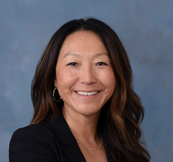 Image showing Leiann Laiks of Strategy Law LLP with straight long hair, smiling at the camera.